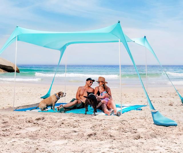 Product image of SUN NINJA Beach Tent Sun Shelter UPF50+ - Easy Pop Up Beach Canopy - Outdoor Shade for Camping Trips, Fishing, Backyard Fun Picnics - Sand Shovel, Ground Pegs & Stability Poles